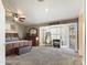Main bedroom with plush carpet and access to patio at 4530 W Misty Willow Ln, Glendale, AZ 85310