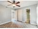 Bedroom with wood-look floors and private bathroom at 4530 W Misty Willow Ln, Glendale, AZ 85310