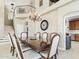 Formal dining room with a large table and access to the kitchen at 4530 W Misty Willow Ln, Glendale, AZ 85310