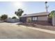 Single-story home with attached garage and desert landscaping at 4530 W Misty Willow Ln, Glendale, AZ 85310