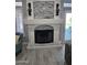 Elegant fireplace with stone surround, in a living room with hardwood floors at 4530 W Misty Willow Ln, Glendale, AZ 85310