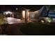 Night view of a home's front yard and landscaping at 4530 W Misty Willow Ln, Glendale, AZ 85310