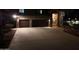 Two-car garage with stone facade and driveway at 4530 W Misty Willow Ln, Glendale, AZ 85310