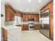 Modern kitchen with wood cabinets and expansive counters at 4530 W Misty Willow Ln, Glendale, AZ 85310