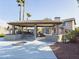 Outdoor kitchen and covered patio with seating area at 4530 W Misty Willow Ln, Glendale, AZ 85310