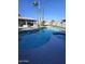 Inviting kidney-shaped pool with spa and lush landscaping at 4530 W Misty Willow Ln, Glendale, AZ 85310