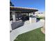 Covered patio and pool with artificial turf at 4530 W Misty Willow Ln, Glendale, AZ 85310