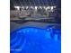 Night view of illuminated pool and pergola with string lights at 4530 W Misty Willow Ln, Glendale, AZ 85310