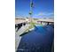 Freeform pool and spa with swim-up bar, surrounded by a paved patio at 4530 W Misty Willow Ln, Glendale, AZ 85310