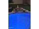 Illuminated pool at night with fire feature and waterfall at 4530 W Misty Willow Ln, Glendale, AZ 85310
