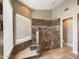 Large walk-in shower with tile surround and bench at 4530 W Misty Willow Ln, Glendale, AZ 85310