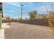 Image of a backyard featuring a gravel ground cover and a dark gray block fence at 4602 N 47Th Ave, Phoenix, AZ 85031