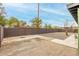 Spacious backyard with gravel and concrete areas, surrounded by a block wall for privacy at 4602 N 47Th Ave, Phoenix, AZ 85031