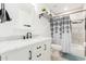 Well-lit bathroom with white vanity, marble countertop, and shower/tub combination at 4602 N 47Th Ave, Phoenix, AZ 85031