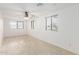 Spacious bedroom with tile floors, ceiling fan, and multiple windows for lots of natural light at 4602 N 47Th Ave, Phoenix, AZ 85031