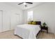 Cozy bedroom with neutral tones, featuring a ceiling fan and ample natural light at 4602 N 47Th Ave, Phoenix, AZ 85031