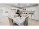 Bright kitchen featuring white cabinets, stainless steel appliances, and a charming dining area at 4602 N 47Th Ave, Phoenix, AZ 85031
