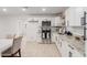 Modern kitchen showcasing white cabinets, granite countertops, and stainless steel appliances at 4602 N 47Th Ave, Phoenix, AZ 85031