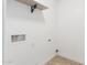 Laundry room with shelf, water hookups, electrical outlets and wood-look tile floors at 4602 N 47Th Ave, Phoenix, AZ 85031