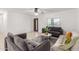 Bright living room featuring tile floors, modern furniture, and a large window at 4602 N 47Th Ave, Phoenix, AZ 85031