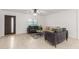 Bright living room featuring tile floors, modern furniture, and a large window at 4602 N 47Th Ave, Phoenix, AZ 85031