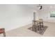 Bright room with tile floors featuring a small table with chairs and natural light at 4602 N 47Th Ave, Phoenix, AZ 85031