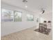 Bright room with tile floors featuring a cozy seating area near large windows at 4602 N 47Th Ave, Phoenix, AZ 85031