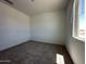 Bright and airy bedroom featuring a large window, letting in ample natural light at 47250 W Mellen Ln, Maricopa, AZ 85139
