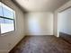 Comfortable bedroom with carpet flooring, neutral paint, and a window for natural light at 47250 W Mellen Ln, Maricopa, AZ 85139