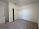 Clean bedroom with a closet with sliding doors and plush carpeting at 47250 W Mellen Ln, Maricopa, AZ 85139