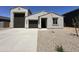 Charming single-story home featuring a neutral color, attached garage, and well-kept landscaping at 47250 W Mellen Ln, Maricopa, AZ 85139