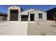 Charming single-story home featuring a three car garage and low maintenance desert landscaping at 47250 W Mellen Ln, Maricopa, AZ 85139
