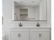 Bathroom featuring double sink vanity with modern fixtures and large vanity mirror at 4816 N 177Th Ln, Goodyear, AZ 85395