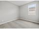 Bright bedroom featuring carpeted flooring with a view out of a window at 4816 N 177Th Ln, Goodyear, AZ 85395