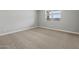 Neutral bedroom with large window and plush carpeting; blank canvas for your design at 4816 N 177Th Ln, Goodyear, AZ 85395