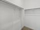 Bright closet with built in shelving and carpeted floor at 4816 N 177Th Ln, Goodyear, AZ 85395