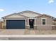 Attractive single-story house with a two-car garage, desert landscaping, and a welcoming front entrance at 4816 N 177Th Ln, Goodyear, AZ 85395