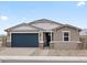 Charming single-story home featuring a two-car garage, neutral stucco, and a desert landscape at 4816 N 177Th Ln, Goodyear, AZ 85395