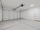 Spacious garage featuring a large door and plenty of room for parking and storage at 4816 N 177Th Ln, Goodyear, AZ 85395