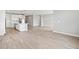 Open-concept living space featuring tile floors and modern light fixtures at 4816 N 177Th Ln, Goodyear, AZ 85395
