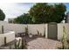 Landscaped courtyard with an orange tree and seating area at 5101 N Casa Blanca Dr # 9, Paradise Valley, AZ 85253