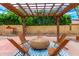 Wooden pergola in backyard with seating for relaxation at 5420 W Apollo Rd, Laveen, AZ 85339