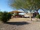 Community playground with shade structure and picnic tables at 6301 S Four Peaks Pl, Chandler, AZ 85249