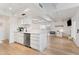 Modern white kitchen with stainless steel appliances and an open layout at 639 E Calavar Rd, Phoenix, AZ 85022