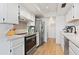 Modern kitchen with stainless steel appliances and white cabinets at 639 E Calavar Rd, Phoenix, AZ 85022