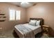 Cozy bedroom with wood accents and a ceiling fan at 6521 E Ashler Hills Dr, Cave Creek, AZ 85331