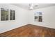 Bright bedroom with hardwood floors and plantation shutters at 7618 E Ironwood Dr, Scottsdale, AZ 85258