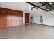 Garage with built-in cabinets and epoxy floor at 7618 E Ironwood Dr, Scottsdale, AZ 85258