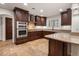 Kitchen with stainless steel appliances and island at 7618 E Ironwood Dr, Scottsdale, AZ 85258