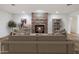 Cozy living room with stone fireplace and built-in shelving at 7618 E Ironwood Dr, Scottsdale, AZ 85258